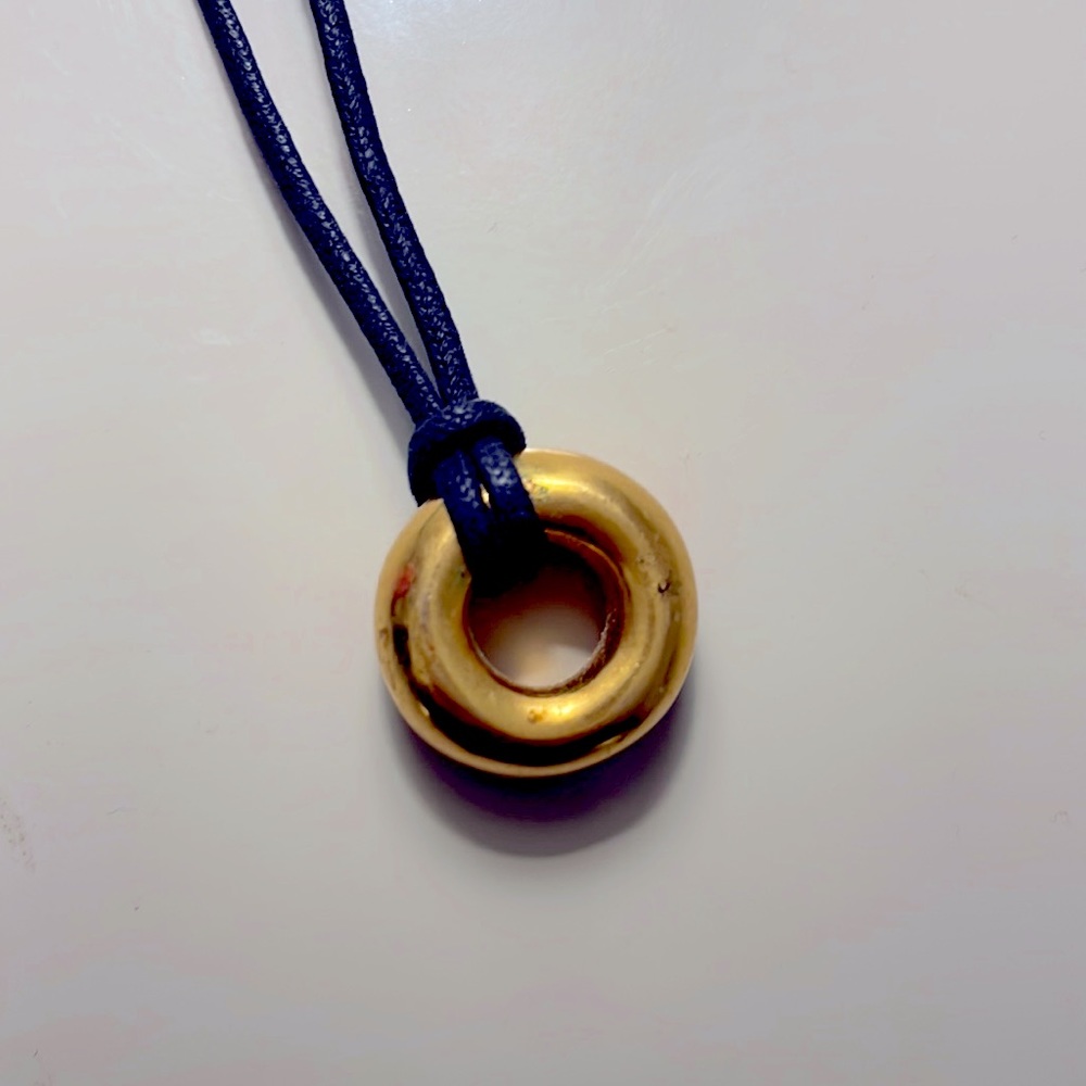 Robert Lee Morris ca 1998 gold plated (?) pendant on leather cord